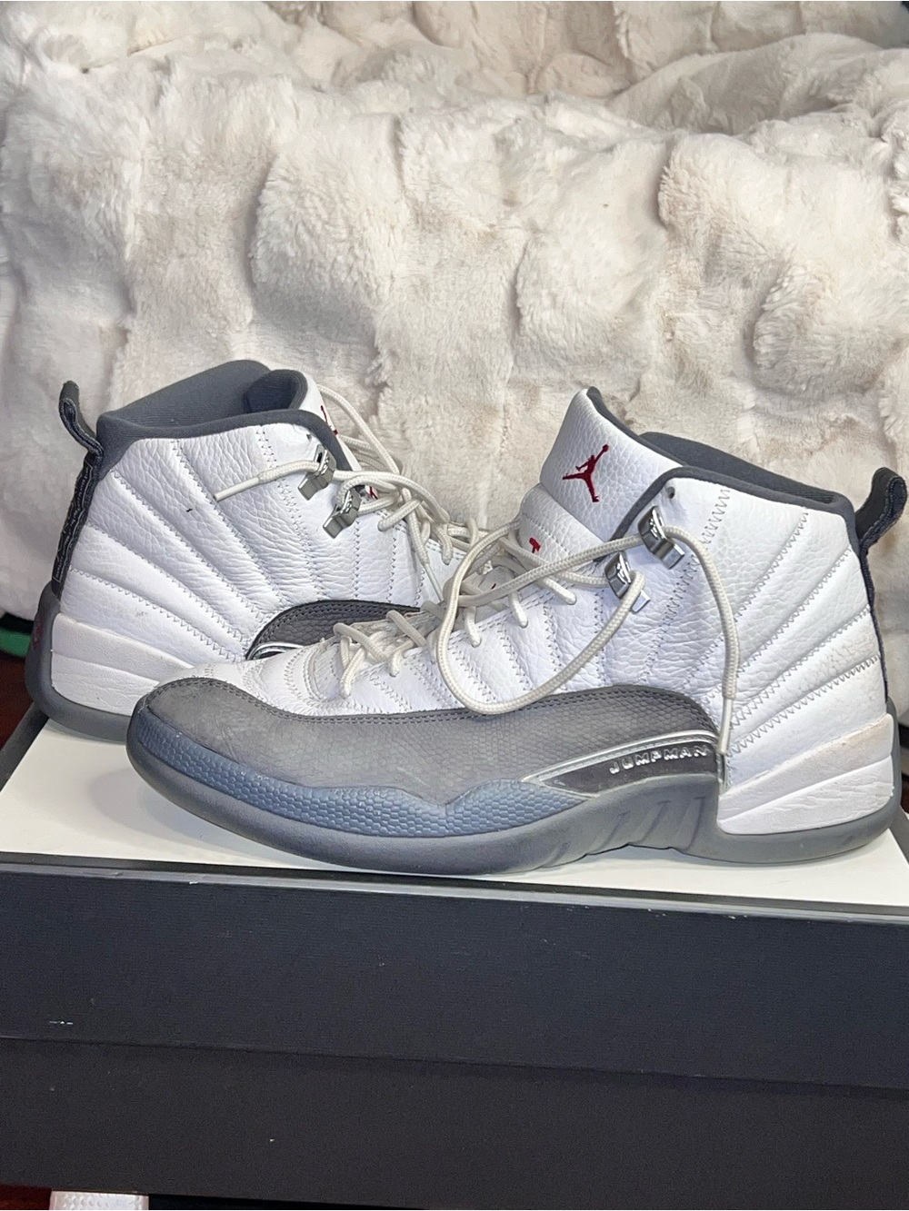 Men’s 9.5 Nike Air Jordan 12 Retro sneakers in a white and dark grey colorway